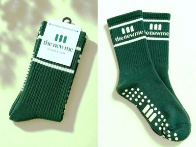 two pairs of green socks with white dots on them