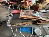 a table that has a lot of books on top of it