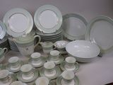 a lot of plates and cups on the table
