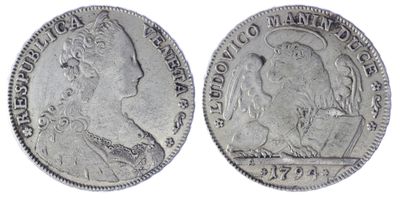 a close up of two silver coins on a white background