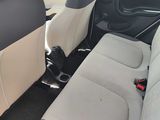 the interior of a small car with two rows of seats