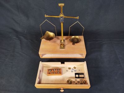 two wooden trays that have a scale on top of them