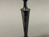 pair of antique silver candlesticks on stand on grey background