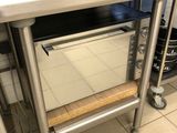 an oven that is sitting on a counter in a kitchen
