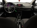 the interior of a small car with a steering wheel and dashboard