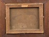 an old picture frame with a picture of a dog in it