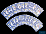a lot of pokemon cards on a black background