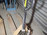 a small hand truck that is parked in a garage