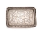 a silver tray with a picture on it on a white surface
