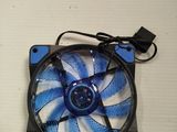 an image of a blue and white fan on a white table