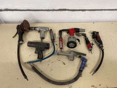 a lot of tools that are laying out on the floor