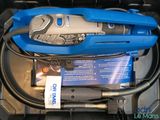 a blue and black blow dryer in a black box