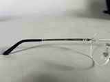 a pair of glasses sitting on a table next to a pair of glasses