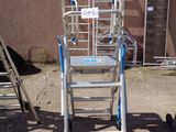 a ladder that is sitting in front of a building