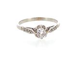 a close up of a diamond ring on a white background