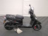 a scooter that is parked on a checkered floor