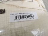 a label on the back of a pillow with a barcode on it