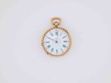 a close up of a pocket watch with roman numerals on the face