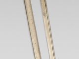pair of two swords with wooden handle and sheaths on a gray background