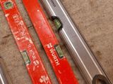 three tools that are laying on the floor next to each other