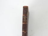 an old book that is sitting on a table