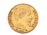 l'image d'une pièce d'or sur laquelle figure le profil d'un homme