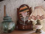 a table with a lamp and a vase on it