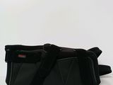 a black bag that is sitting on a table