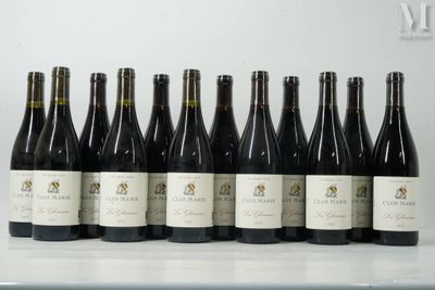 six bottles of wine are lined up in a row on a table