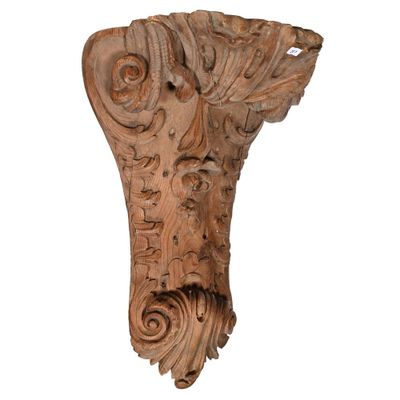 an image of a wooden corb with a face on it
