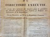 an old newspaper with a piece of paper on top of it