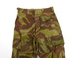 the shorts are camouflaged and have buttons on the side