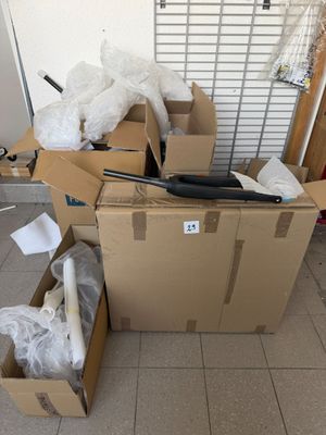 a pile of boxes with a laptop on top of it