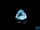 a blue topazte gems on a black background