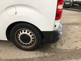a white van that is parked in a parking lot