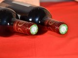 three bottles of wine sitting next to each other on a table