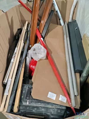 a box full of baseball bats and other baseball equipment