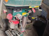 a small drill machine that is sitting on a table