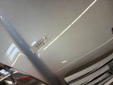 a close up of a car ' s front grill with a sticker on it