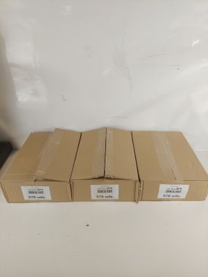 four boxes of brown paper sitting on top of a white table