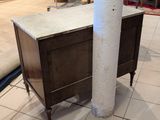 a table with a marble top and a wooden base