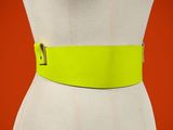 a close up of a mannequin torso with a yellow belt