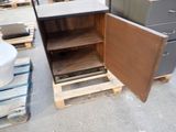 a wooden cabinet with a door open on pallets