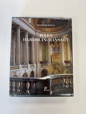 an image of a book with a picture of a building in the background
