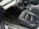 the interior of a white car with black leather seats and a steering wheel