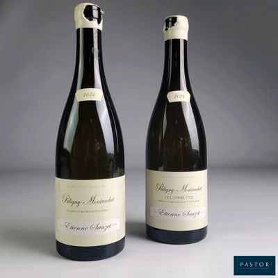 two bottles of wine sitting next to each other on a table
