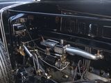 a very old car with a very nice engine in it