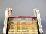 a lot of books stacked on top of each other