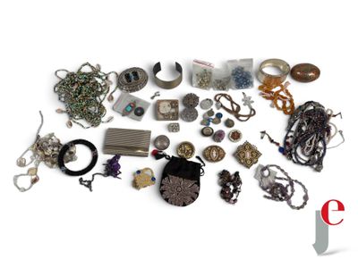 many different types of jewelry on a white surface