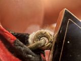 a person holding a small piece of metal in their hand